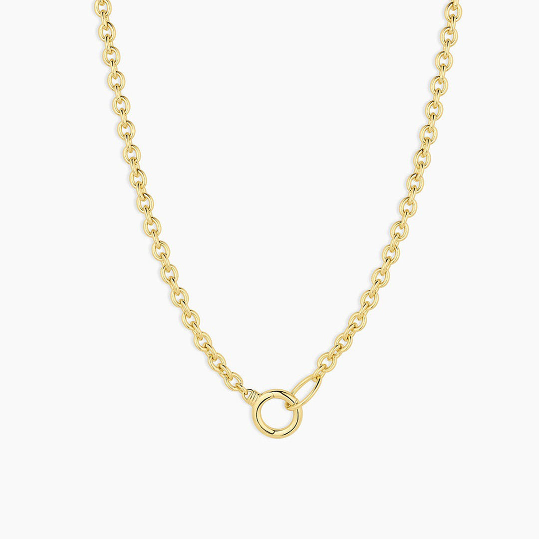 Gold chain necklace on a white background