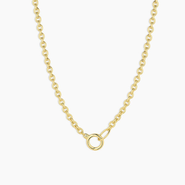 Gold chain necklace on a white background