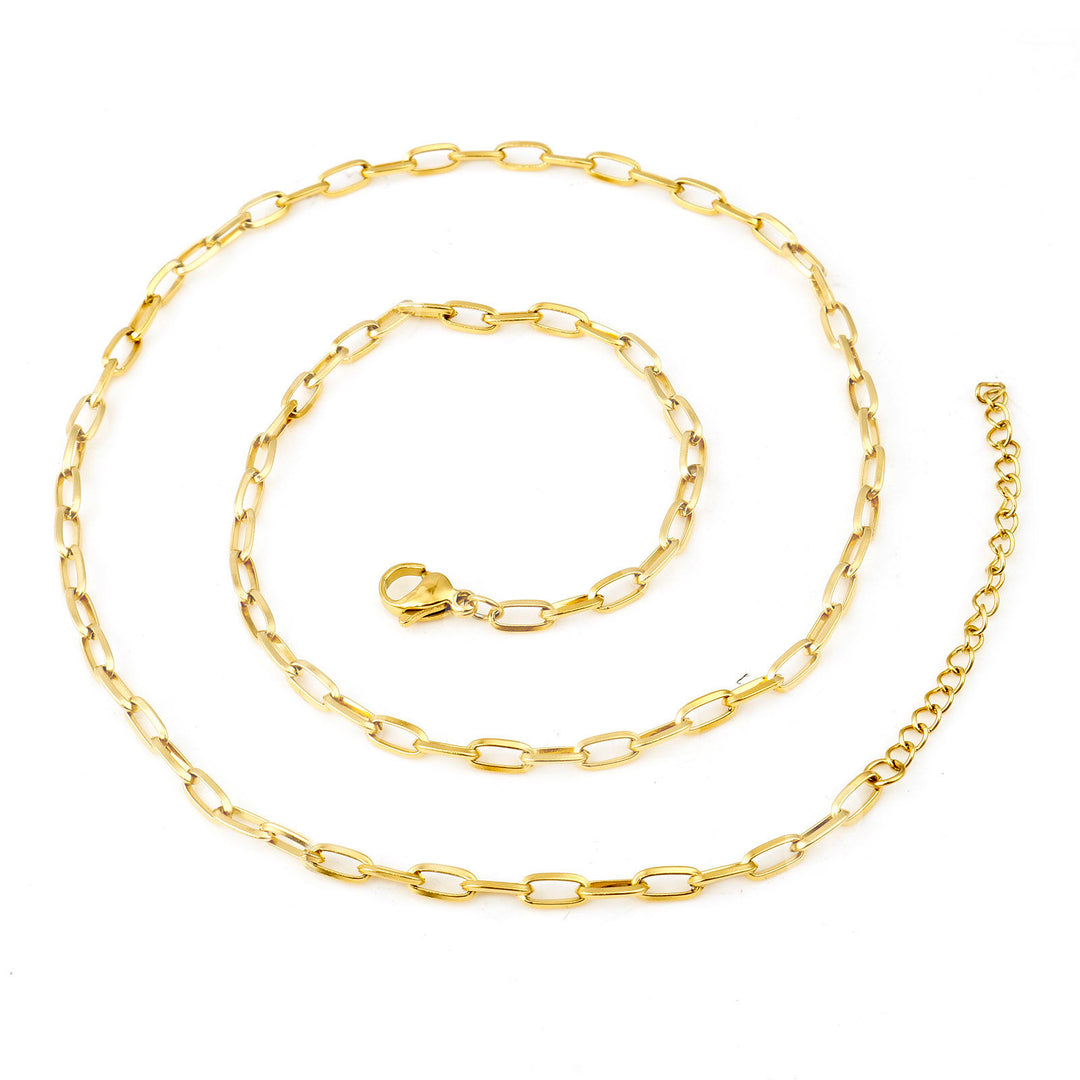 Gold chain necklace and bracelet set on a white background